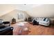 Spacious bonus room with hardwood floors, comfortable seating, and natural light from the window at 1564 Spring Se St, Smyrna, GA 30080