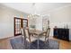Stylish dining room with elegant lighting, a wooden table, and comfortable seating for Gathering gatherings at 1564 Spring Se St, Smyrna, GA 30080