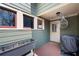 Cozy covered entry with warm wood floors, stylish lighting, and space for plants at 1564 Spring Se St, Smyrna, GA 30080