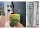Exterior view of the house with low foundation plantings and a side entrance at 1564 Spring Se St, Smyrna, GA 30080