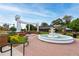 Charming fountain in Smyrna Market Village surrounded by lush greenery and brick walkways at 1564 Spring Se St, Smyrna, GA 30080