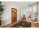 Elegant foyer with hardwood floors, a decorative rug, and a beautifully crafted wooden front door at 1564 Spring Se St, Smyrna, GA 30080