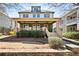 Inviting two-story home with a covered front porch and beautifully maintained landscaping at 1564 Spring Se St, Smyrna, GA 30080