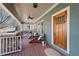 Charming front porch features comfortable seating, a swing, and a welcoming entrance at 1564 Spring Se St, Smyrna, GA 30080