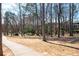 Scenic park walkway with mature trees and natural landscape provides a peaceful retreat at 1564 Spring Se St, Smyrna, GA 30080