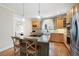 Well-equipped kitchen boasts stainless steel appliances, granite countertops and a gas cooktop island at 1564 Spring Se St, Smyrna, GA 30080