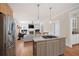 Open-concept kitchen features a gas cooktop island and stainless steel appliances, great for entertaining at 1564 Spring Se St, Smyrna, GA 30080