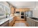 Spacious kitchen featuring granite countertops, stainless steel appliances, and hardwood flooring at 1564 Spring Se St, Smyrna, GA 30080