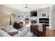 Bright living room with a fireplace, built-in shelving, and a zebra-striped rug at 1564 Spring Se St, Smyrna, GA 30080