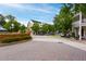 Inviting street view featuring a brick-paved road, lush trees, and charming buildings with classic architectural details at 1564 Spring Se St, Smyrna, GA 30080