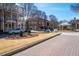 Street view featuring quaint buildings with balconies and a charming gazebo, enhancing the neighborhood's appeal at 1564 Spring Se St, Smyrna, GA 30080