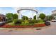 Smyrna Market Village entrance featuring manicured landscaping and inviting archway at 1564 Spring Se St, Smyrna, GA 30080
