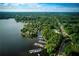 Aerial view of the community showing lake access, boat slips, and winding roads at 320 Woodlake Ct, Alpharetta, GA 30005