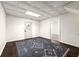 Finished basement featuring tile ceilings and an exterior exit at 320 Woodlake Ct, Alpharetta, GA 30005