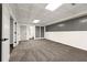 Finished basement space with plush carpeting and easy access to additional rooms at 320 Woodlake Ct, Alpharetta, GA 30005