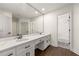 Bright bathroom with double sinks, stone countertops, and a separate shower at 320 Woodlake Ct, Alpharetta, GA 30005