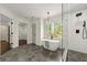 Bright bathroom featuring soaking tub, walk-in shower and great natural light at 320 Woodlake Ct, Alpharetta, GA 30005