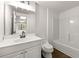 Bathroom featuring tile floors, a vanity, and a tub-shower combo at 320 Woodlake Ct, Alpharetta, GA 30005