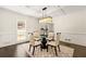 Bright dining room featuring a chandelier, table, and four chairs at 320 Woodlake Ct, Alpharetta, GA 30005