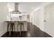 Bright kitchen featuring an island with bar seating, stainless steel appliances, and ample cabinet space at 320 Woodlake Ct, Alpharetta, GA 30005