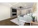 Comfortable main bedroom with fireplace, tv, and hardwood floors at 320 Woodlake Ct, Alpharetta, GA 30005