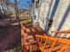 Wooden deck with railing overlooking the backyard, featuring outdoor access at 326 Rockland Way, Lawrenceville, GA 30046