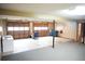 Spacious garage with two doors, laundry sink, and room for multiple vehicles at 326 Rockland Way, Lawrenceville, GA 30046