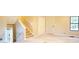Spacious living room with neutral paint, neutral carpet, stairs, and a closet at 326 Rockland Way, Lawrenceville, GA 30046