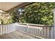 A charming balcony offers views of the surrounding trees and greenery at 3772 Paces Ferry West Se, Atlanta, GA 30339
