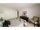 Bedroom with a dresser, closet and large framed art at 3772 Paces Ferry West Se, Atlanta, GA 30339