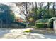 Landscaped entrance and flower beds welcome you to the community at 3772 Paces Ferry West Se, Atlanta, GA 30339