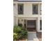 Home featuring a welcoming front entrance with double doors and manicured garden at 3772 Paces Ferry West Se, Atlanta, GA 30339