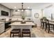 Updated kitchen featuring grey cabinets, granite countertops, and a stylish island with seating at 3772 Paces Ferry West Se, Atlanta, GA 30339