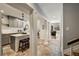 Open concept kitchen with grey cabinets, granite countertops, and a kitchen island with seating at 3772 Paces Ferry West Se, Atlanta, GA 30339