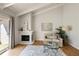 Inviting living room with fireplace and cozy seating, ideal for relaxing and entertaining guests at 3772 Paces Ferry West Se, Atlanta, GA 30339