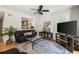 Comfortable living room featuring an open concept design and hardwood flooring at 3772 Paces Ferry West Se, Atlanta, GA 30339