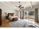 Bright and airy main bedroom with hardwood floors, vaulted ceilings, and private balcony access at 3772 Paces Ferry West Se, Atlanta, GA 30339