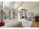 Main bedroom suite with hardwood floors, fireplace, and private balcony, perfect for relaxation at 3772 Paces Ferry West Se, Atlanta, GA 30339