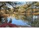 Beautiful pond surrounded by mature trees and landscaping in the community at 3772 Paces Ferry West Se, Atlanta, GA 30339