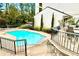 Community swimming pool with patio, tables, and chairs next to the clubhouse at 3772 Paces Ferry West Se, Atlanta, GA 30339
