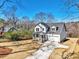 New construction home with concrete driveway and well manicured yard at 5272 Poplar Springs Rd, Stone Mountain, GA 30083