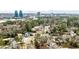 Scenic aerial shot of an upscale neighborhood with lush trees and the cityscape skyline in the background at 800 Glenairy Dr, Atlanta, GA 30328