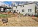 The backyard features a brick patio, a greenhouse, and a spacious lawn at 800 Glenairy Dr, Atlanta, GA 30328