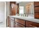 Elegant bathroom with double sink vanity, dark wood cabinetry, and a large mirror reflecting the shower at 800 Glenairy Dr, Atlanta, GA 30328