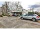 Spacious driveway leads to a house with a covered parking area for multiple vehicles at 800 Glenairy Dr, Atlanta, GA 30328