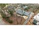 Exterior view of a well-maintained home with mature trees and a nicely manicured yard at 800 Glenairy Dr, Atlanta, GA 30328