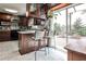This kitchen features stainless steel appliances, dark cabinetry, and a large window to the outside at 800 Glenairy Dr, Atlanta, GA 30328