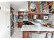 Open concept kitchen featuring stainless steel appliances, dark cabinetry, and barstool seating at 800 Glenairy Dr, Atlanta, GA 30328