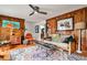 Charming living room with wood paneling, hardwood floors, and a stylish area rug at 800 Glenairy Dr, Atlanta, GA 30328