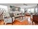 Bright living room with hardwood floors, comfortable seating, and stylish decor, creating a cozy gathering space at 800 Glenairy Dr, Atlanta, GA 30328
